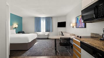 Desk, laptop workspace, blackout drapes, iron/ironing board