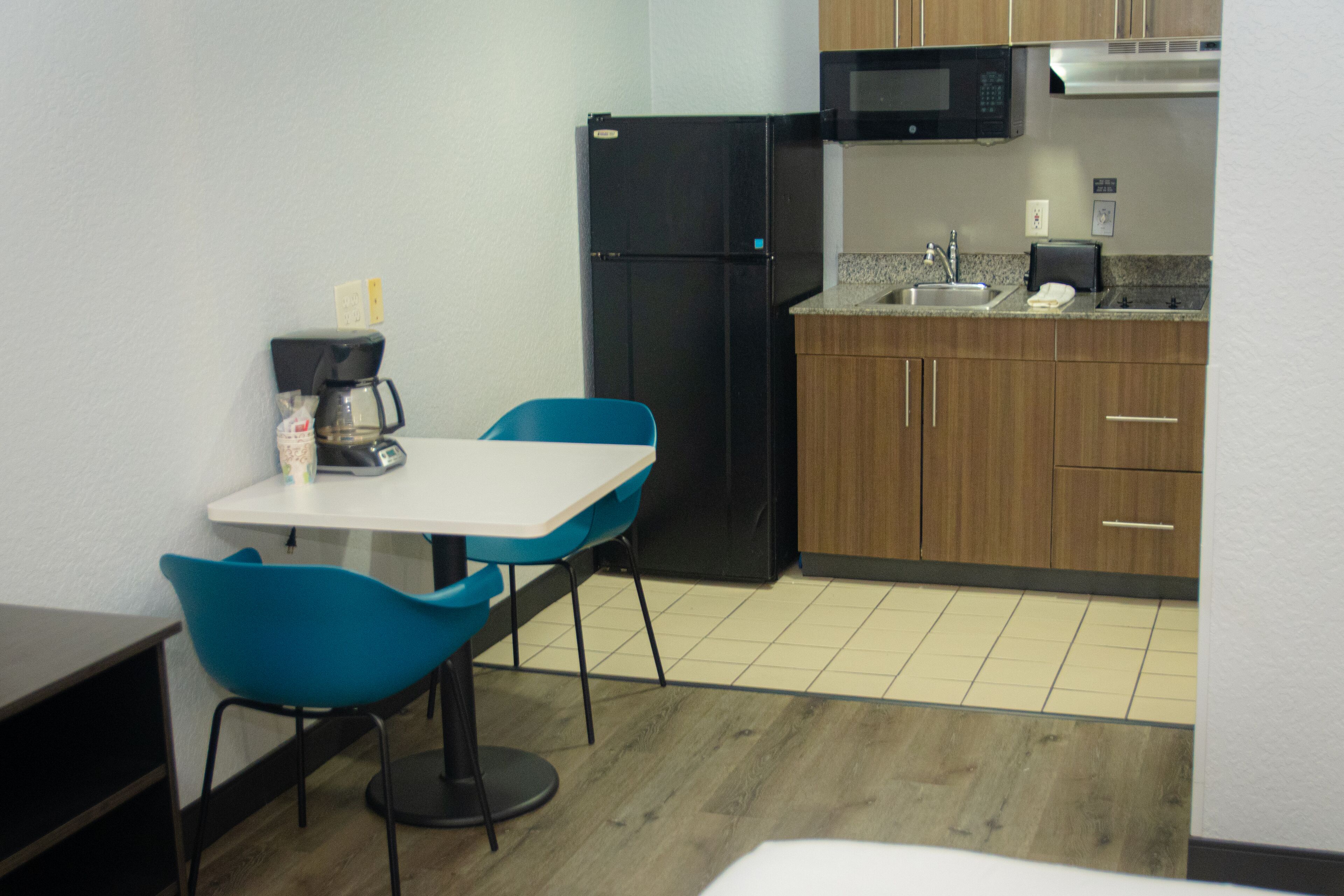 Full-size fridge, microwave, stovetop, coffee/tea maker