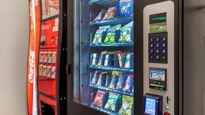 A vending machine with snacks and beverages, including Doritos and Coca-Cola. - Comfort Inn Blairsville Butternut Creek (Blairsville)