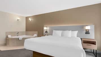 Premium bedding, desk, laptop workspace, blackout drapes