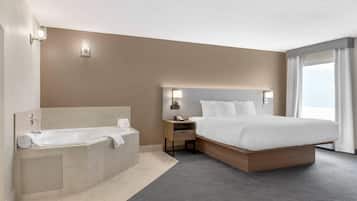 Premium bedding, desk, laptop workspace, blackout drapes
