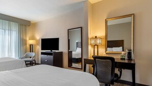 A hotel room with two beds, a desk with a chair, a television, a mirror, and a lamp. - Best Western Plus Dalton Inn (Dalton)