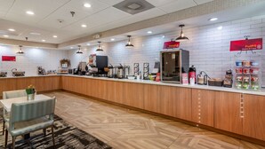 A breakfast bar with a coffee machine, a kettle, and various food items. - Best Western Plus Dalton Inn (Dalton)