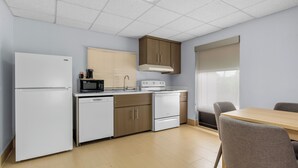 A modern kitchen with a refrigerator, microwave, stove, and dishwasher. - Comfort Inn Douglasville - Atlanta West (Douglasville)