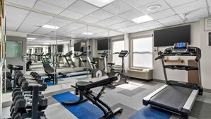 A gym with treadmills, weight machines, and dumbbells. - Comfort Inn Douglasville - Atlanta West (Douglasville)
