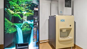 A vending machine with a waterfall display, a control panel, and a water dispenser. - Comfort Inn Douglasville - Atlanta West (Douglasville)