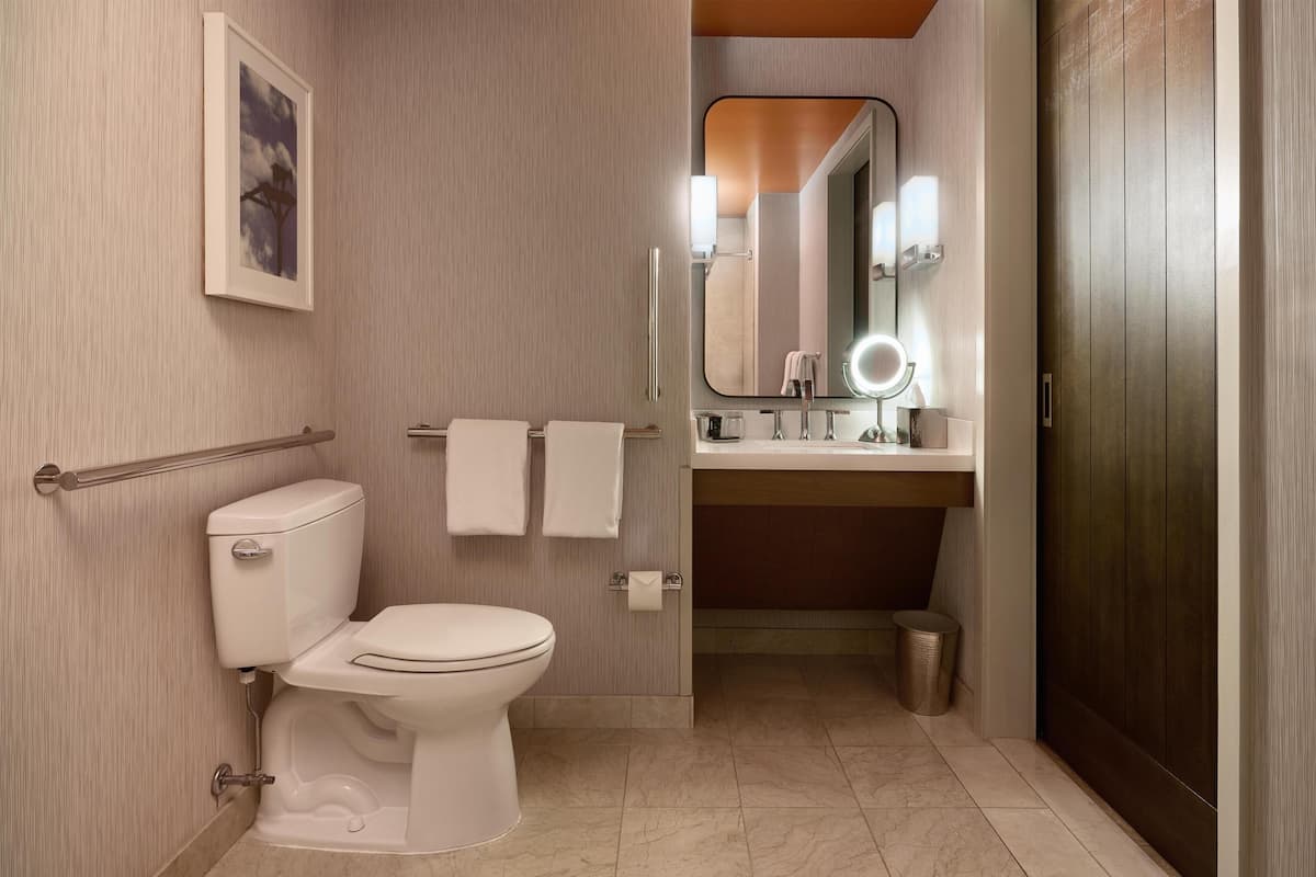 Shower, designer toiletries, hair dryer, bathrobes