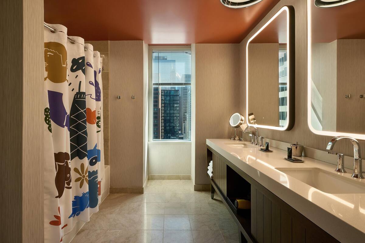 room, 1 king bed, corner | bathroom | shower, designer toiletries, hair dryer, bathrobes