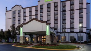 A Holiday Inn hotel with a modern design, featuring a large entrance and multiple floors. - Holiday Inn Chicago Northwest-Elgin by IHG (Elgin)