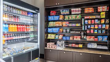 A grocery store with refrigerated beverages and snacks.