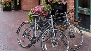 A building with a sign reading "THE DAGNY" and a brick facade. There are two bicycles parked in front. - The Dagny Boston (Boston)
