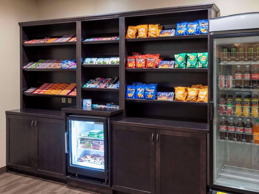 A snack and beverage display area with various snacks and drinks.