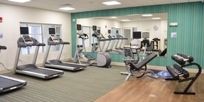 A fitness center with treadmills, elliptical machines, and a weight bench. - Holiday Inn Express & Suites Omaha - 120th and Maple by IHG (Omaha)