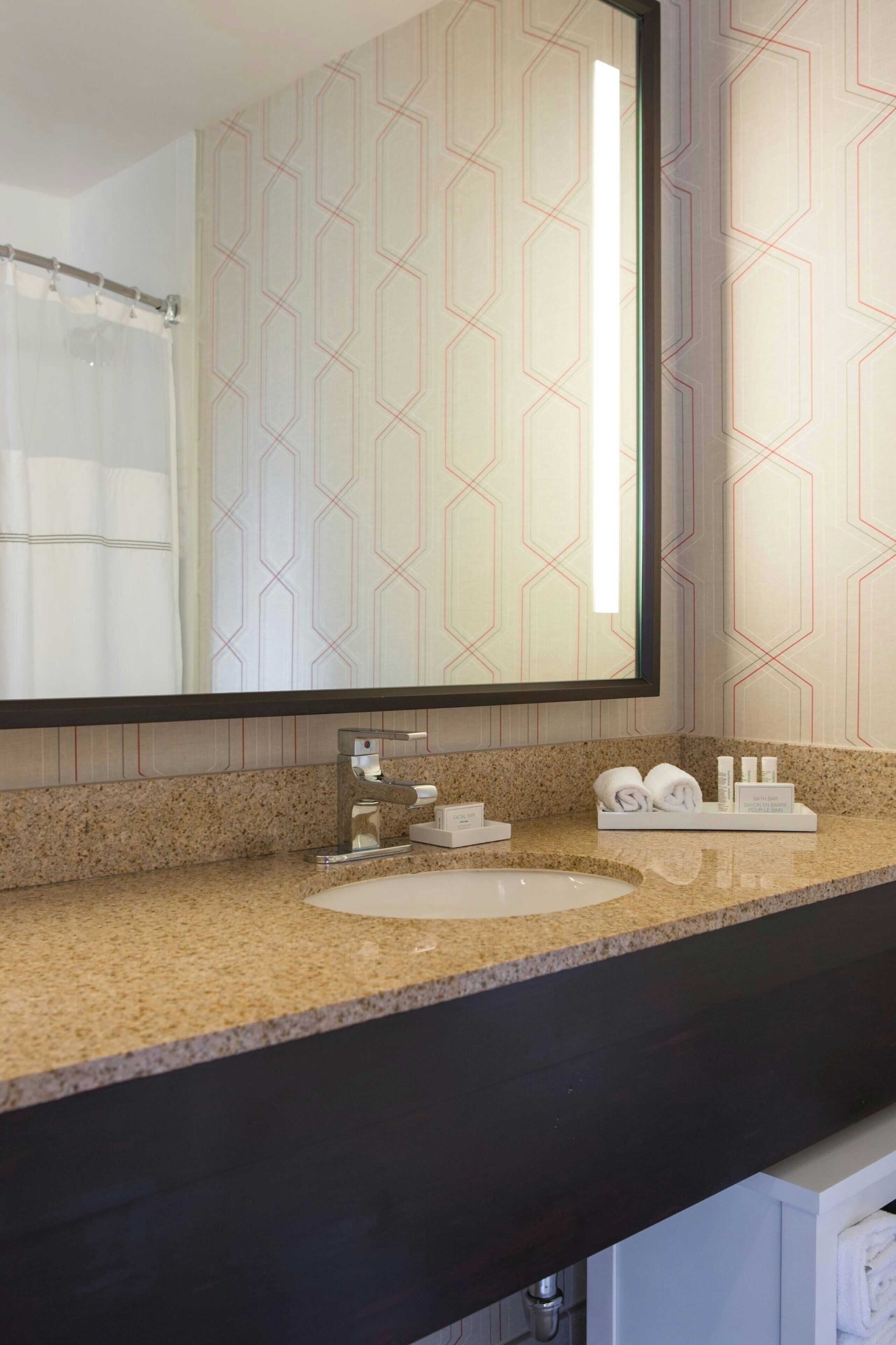 combined shower/bathtub, free toiletries, hair dryer, towels