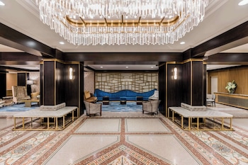 Hotel entrance and lobby at Martinique New York on Broadway, Curio Collection by Hilton