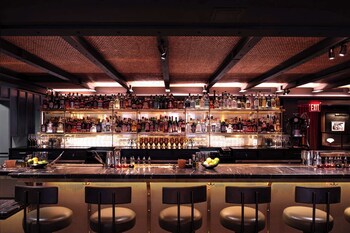 Cocktail bar at Martinique New York on Broadway, Curio Collection by Hilton