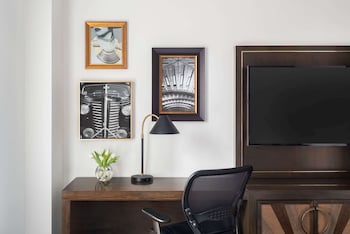 In-room safe, desk, laptop workspace, blackout drapes at Martinique New York on Broadway, Curio Collection by Hilton