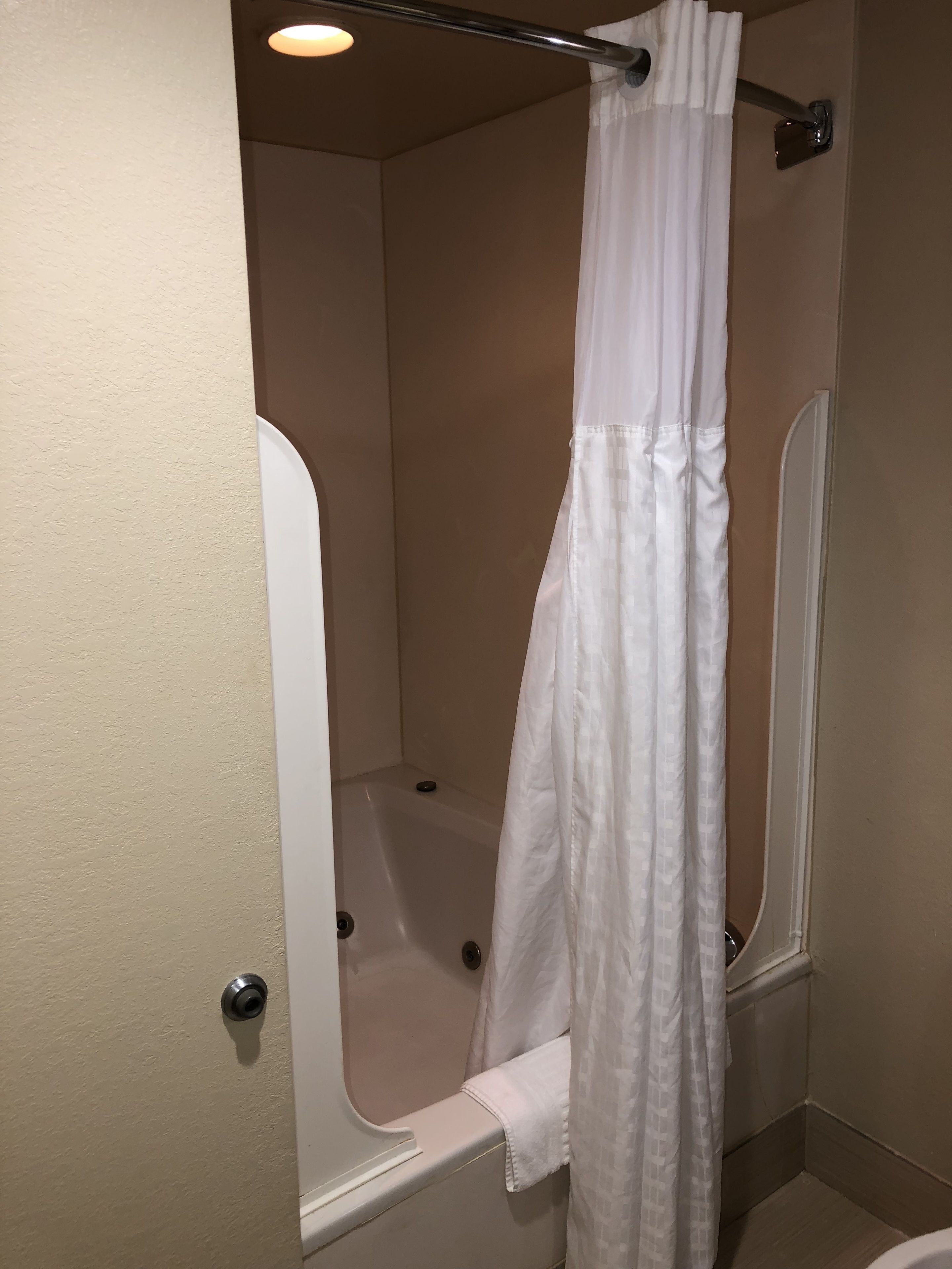 suite, 1 king bed, jetted tub | bathroom | combined shower/bathtub, hair dryer, towels