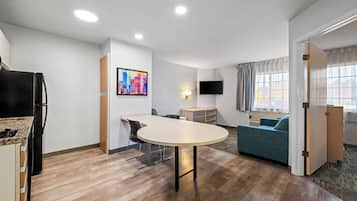 Desk, laptop workspace, blackout drapes, iron/ironing board