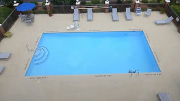 Seasonal outdoor pool, pool umbrellas, pool loungers