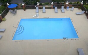 Seasonal outdoor pool, open 9:00 AM to 9:00 PM, pool umbrellas