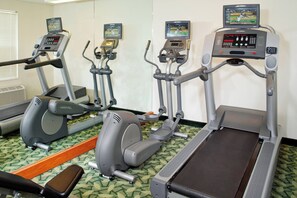 A gym with treadmills, elliptical machines, and a stationary bike. - Towneplace Suites By Marriott Cleveland Westlake (Westlake)