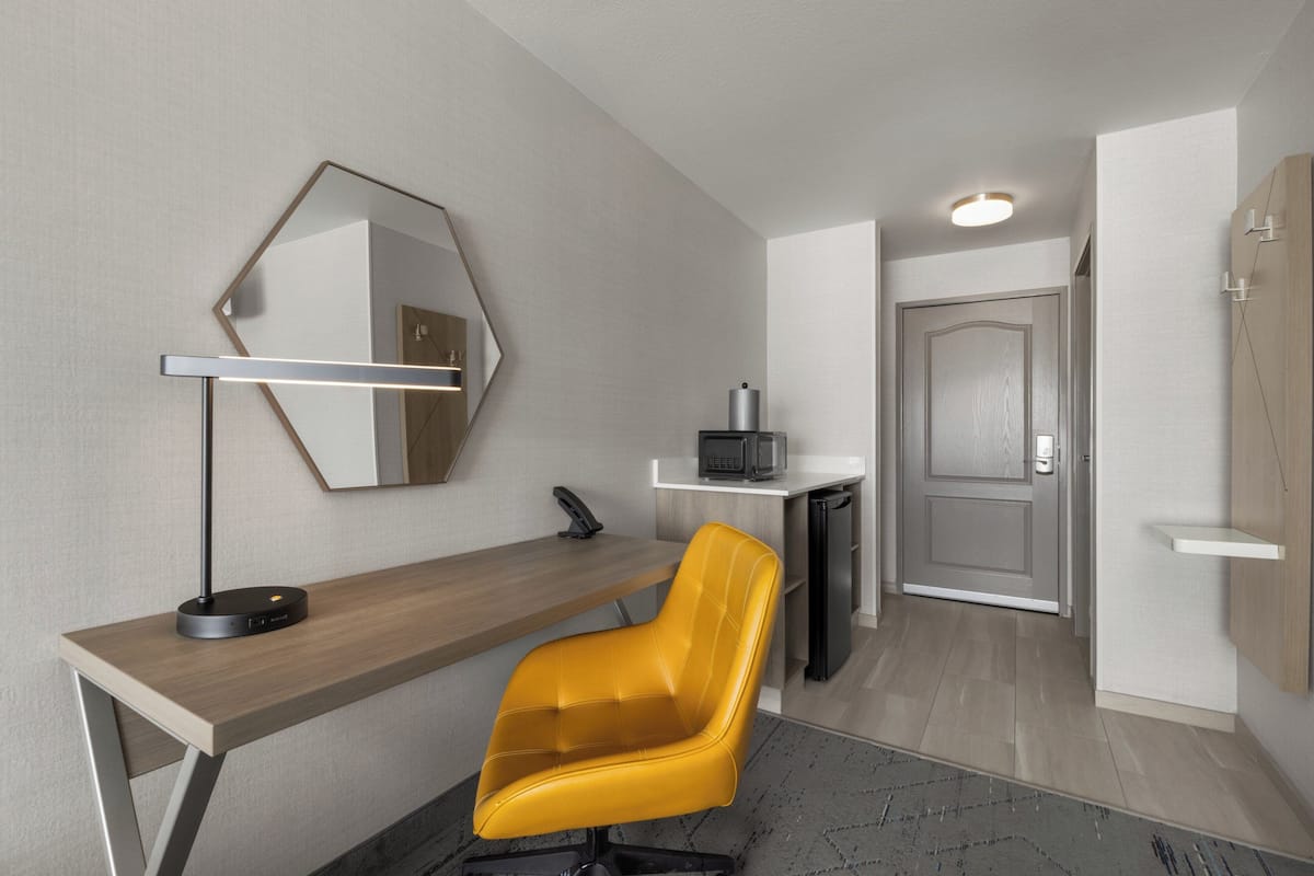 Suite, 1 King Bed | Desk, blackout drapes, iron/ironing board, cribs (free)