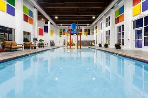 Indoor pool, open 7:00 AM to 11:00 PM, pool loungers