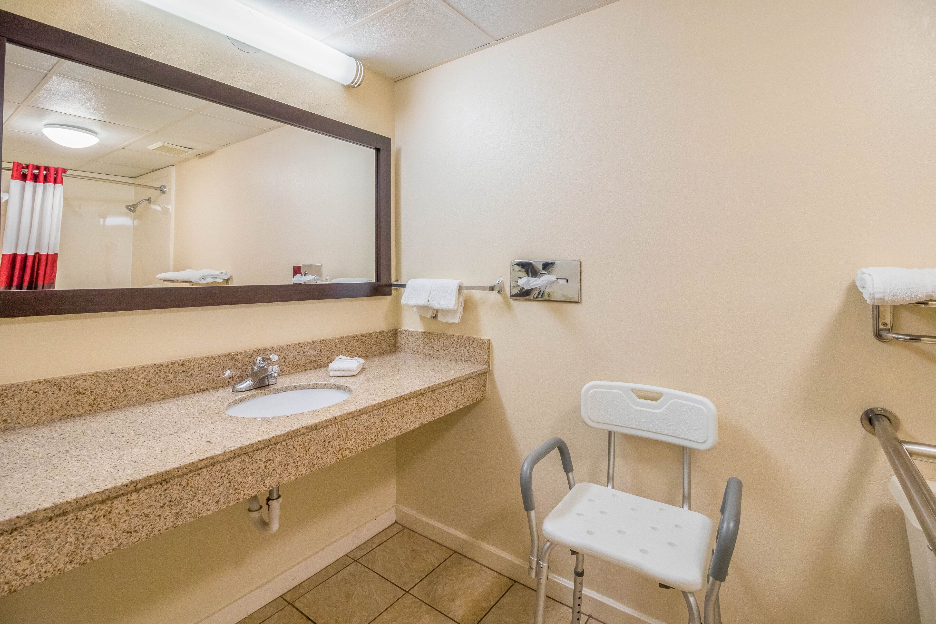 deluxe room, 2 double beds, accessible, smoking | bathroom | free toiletries, hair dryer, towels, soap