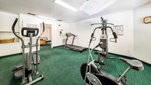A fitness room with treadmills, an elliptical, and a stationary bike. - Travelodge by Wyndham Decatur TX I-287 (Decatur)