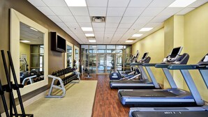 A gym with treadmills, dumbbells, and weight machines. - Embassy Suites by Hilton Dulles Airport (Herndon)