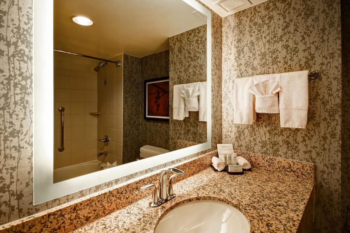 designer toiletries, hair dryer, bathrobes, towels