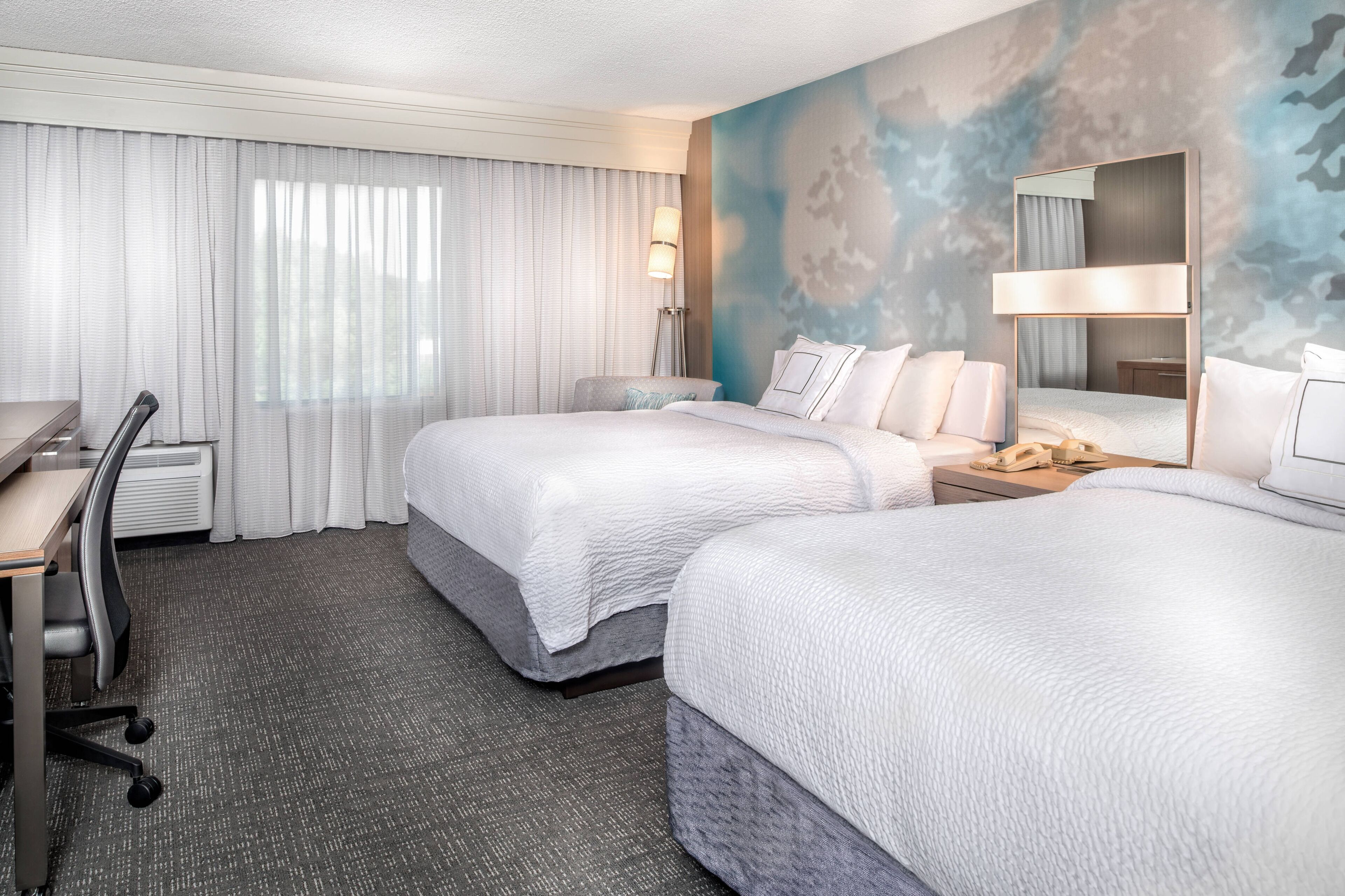 Premium bedding, pillowtop beds, desk, blackout drapes