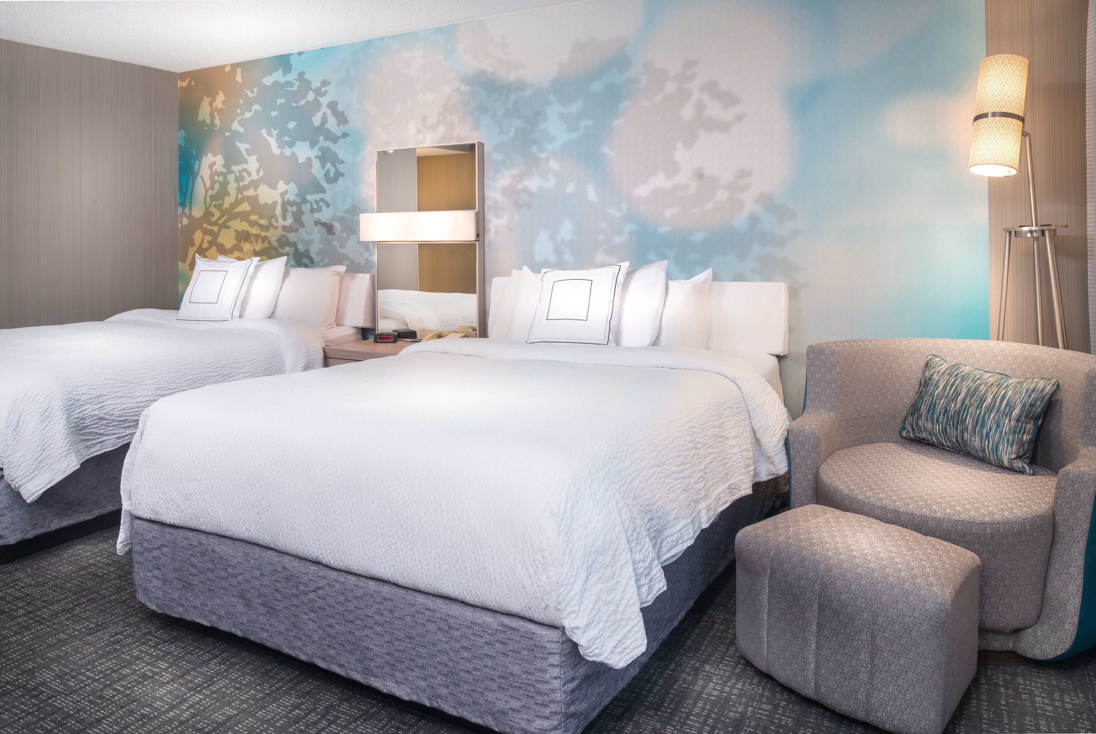 premium bedding, pillow-top beds, desk, blackout curtains