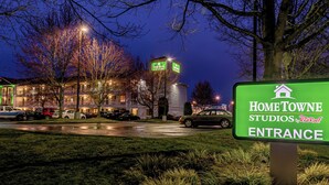 A building with a sign reading 'HomeTowne Studios by Red Roof Entrance.' - HomeTowne Studios by Red Roof Tacoma - Puyallup (Puyallup)