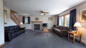 Deluxe Three Bedroom House | Living area | Flat-screen TV, toys