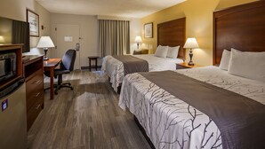 A hotel room with two beds, a desk, a chair, a TV, and a small table. - Best Western Home Place Inn (Camden)