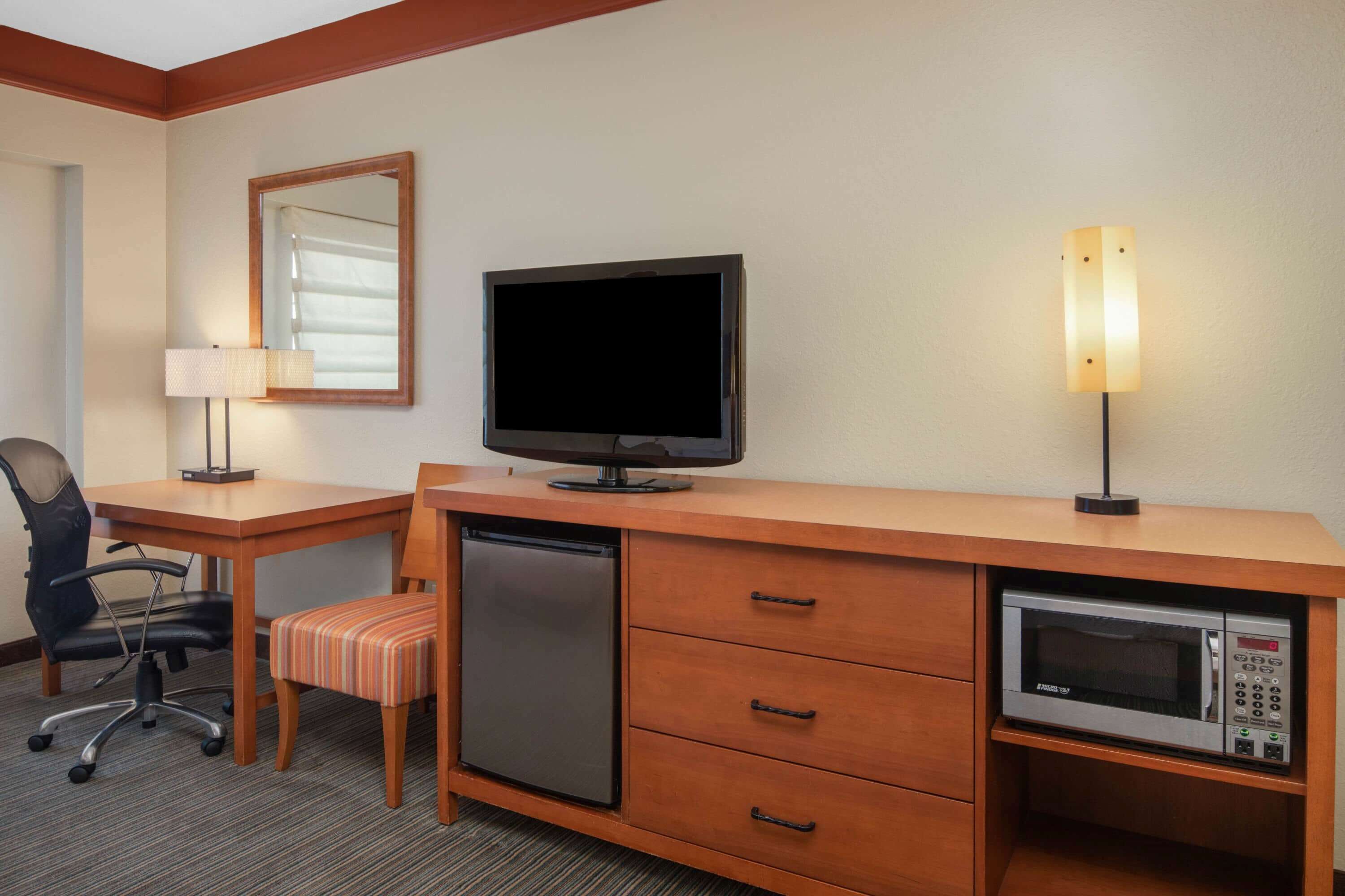 premium bedding, laptop workspace, iron/ironing board