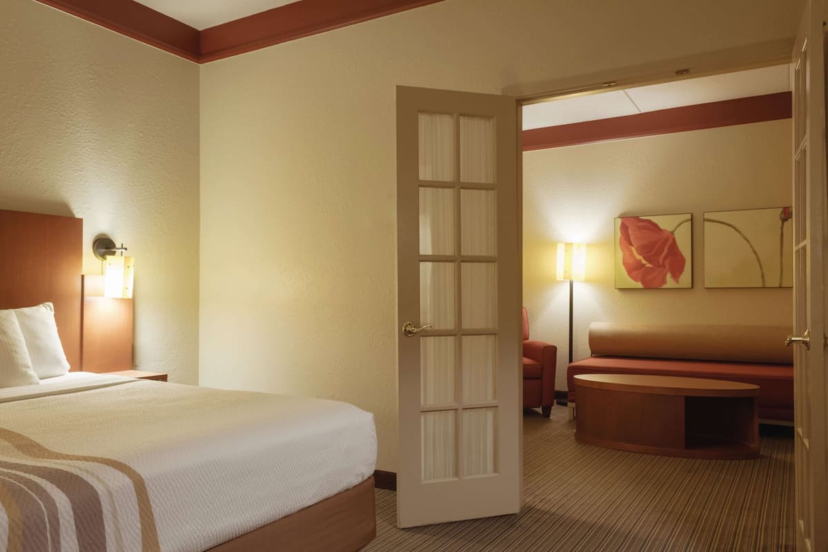 Suite, 1 King Bed, Non Smoking | Premium bedding, laptop workspace, iron/ironing board