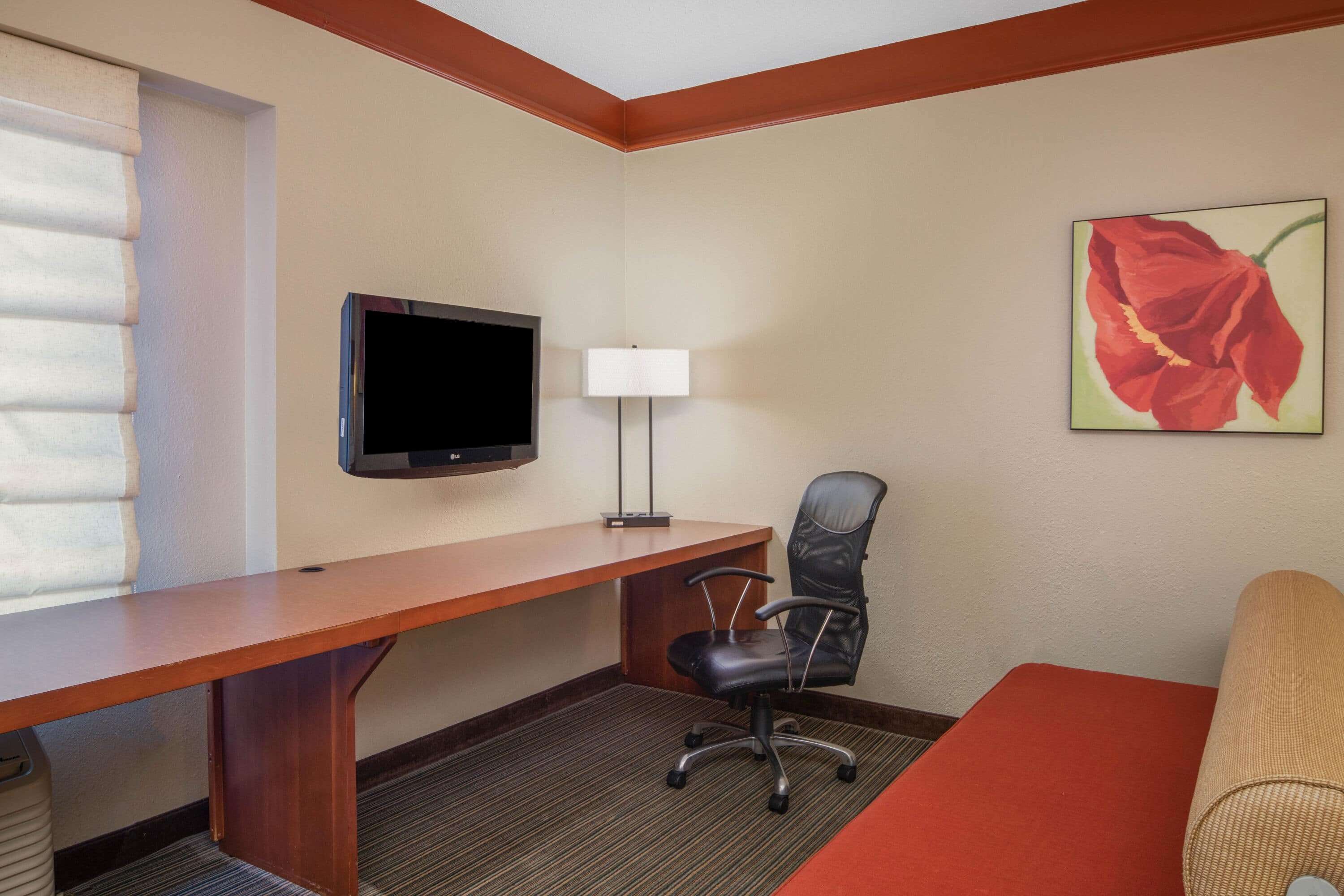 premium bedding, laptop workspace, iron/ironing board