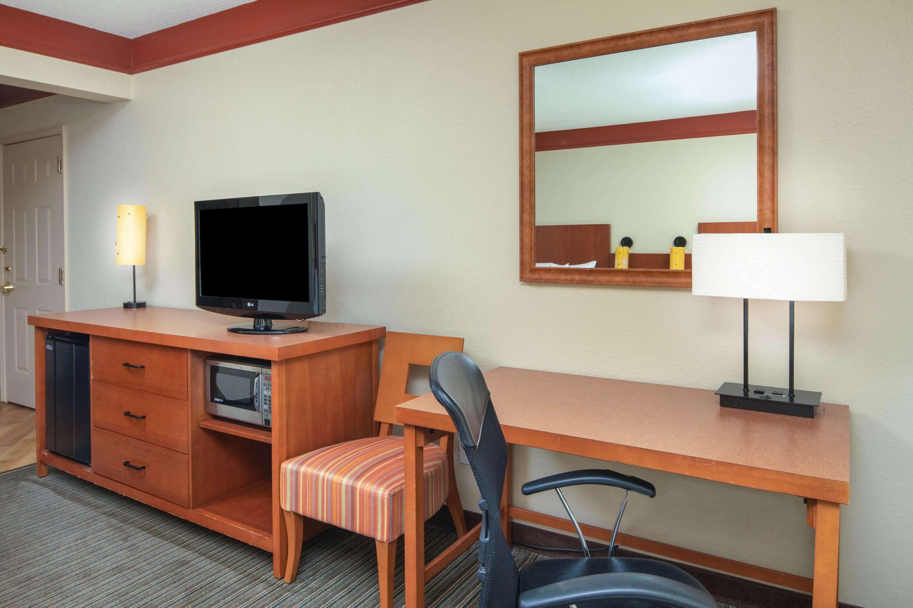 premium bedding, laptop workspace, iron/ironing board