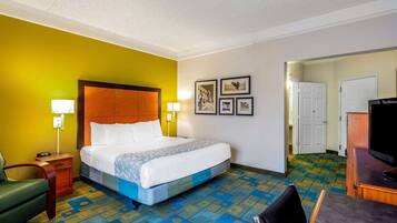 Premium bedding, desk, laptop workspace, blackout drapes