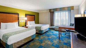 A hotel room with two beds, a desk, a television, and a window with curtains. - La Quinta Inn & Suites by Wyndham Fremont / Silicon Valley (Fremont)