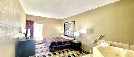 Deluxe Studio Suite, 1 King Bed, Non Smoking | Desk, laptop workspace, blackout drapes, iron/ironing board