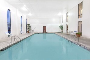 Indoor pool, open 9:00 AM to 9:00 PM, pool loungers