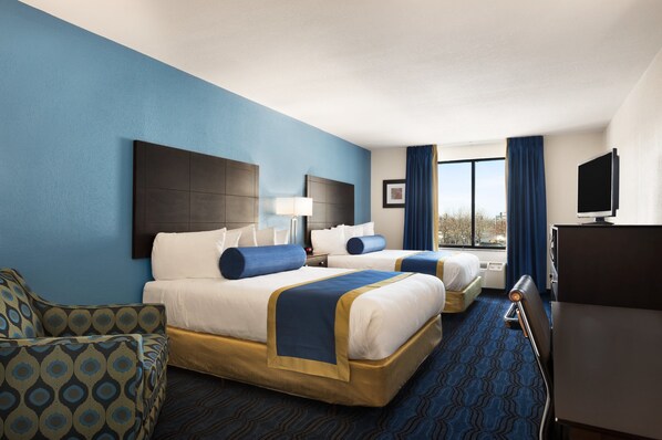 Ropa de cama de alta calidad y caja de seguridad en la habitación