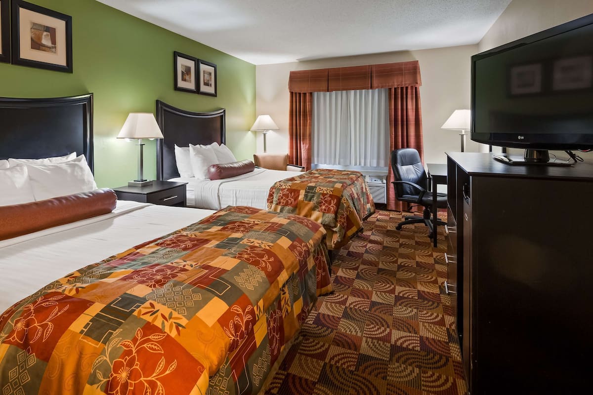 Premium bedding, pillow-top beds, desk, laptop workspace