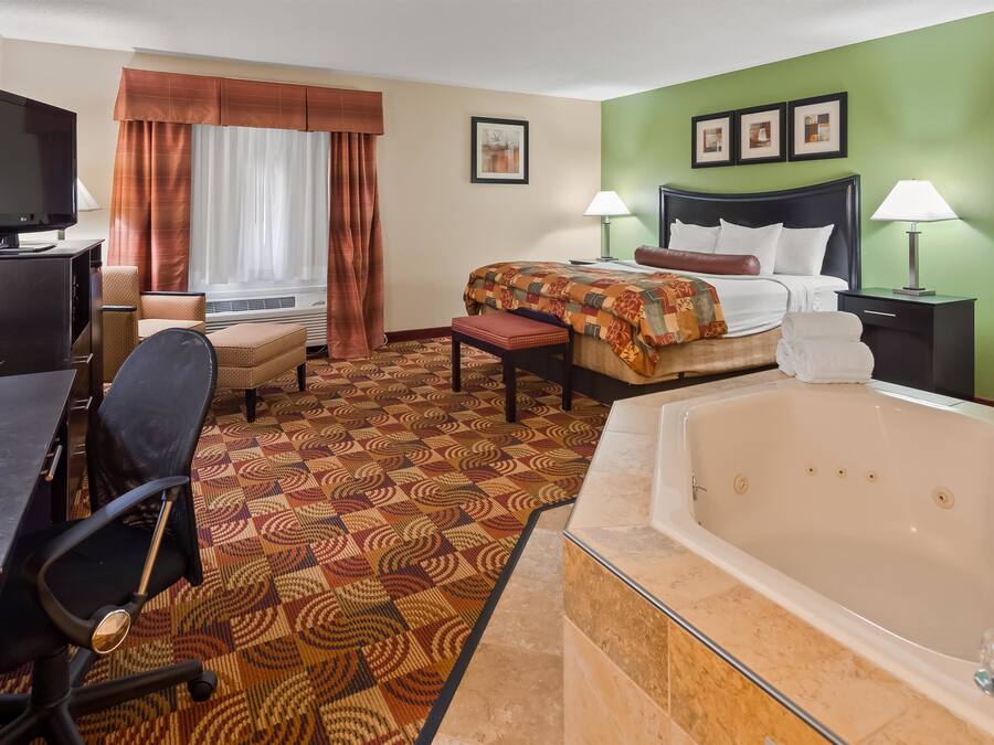 Premium bedding, pillow-top beds, desk, laptop workspace