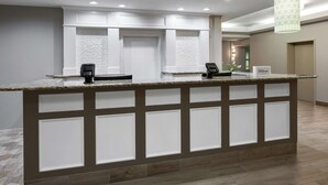 A reception area with a marble counter, two card readers, and a 'Hilton Honors' sign. - Hilton Garden Inn Albuquerque North/Rio Rancho (Rio Rancho)