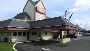 Situated on a corner lot, the Lakeview Inn features a distinctive architectural style with a peaked roof and a large sign.